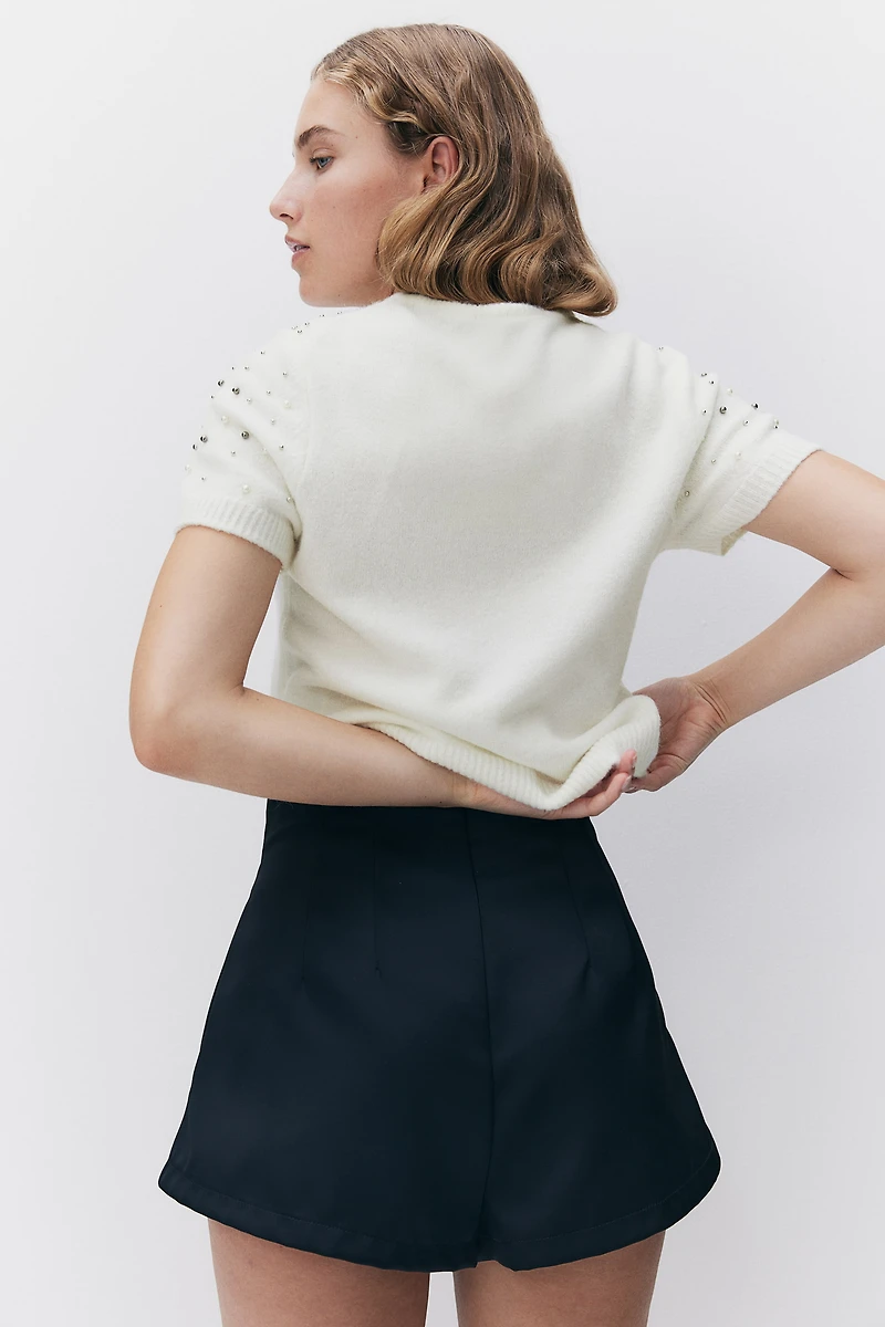 Haut ornementé en fin tricot