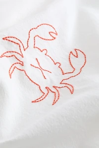 Chemin de table en lin mélangé avec motifs brodés