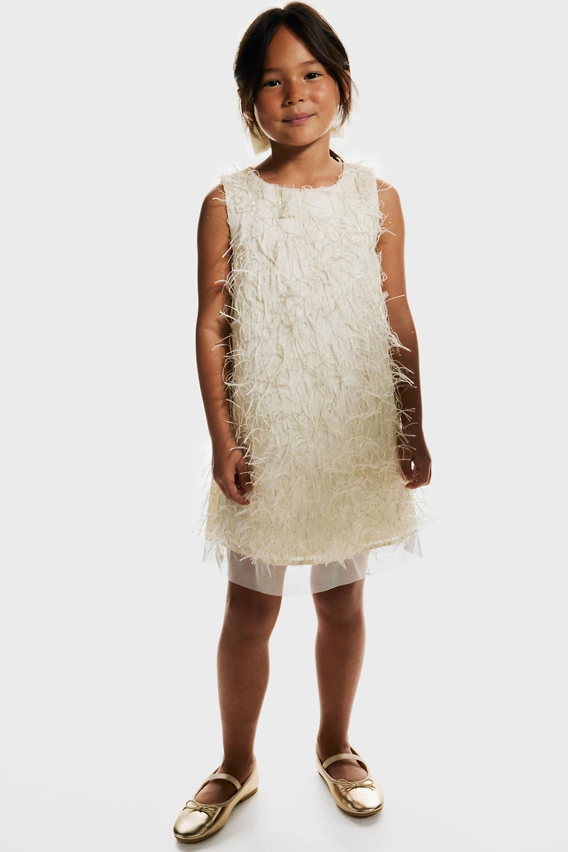 Robe à franges scintillantes