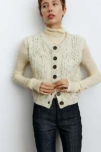 Jean aux chevilles évasé taille haute