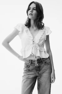 Blouse volantée en satin