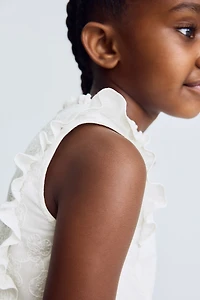 Haut péplum brodé en coton