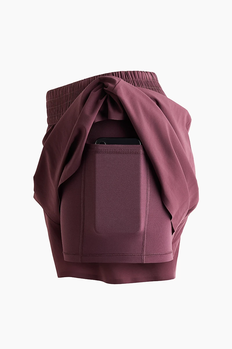 Short de sport superposé avec poche