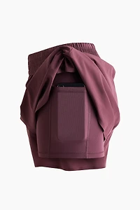 Short de sport superposé avec poche