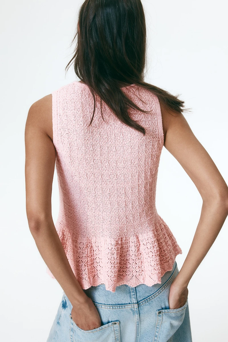 Haut péplum en tricot pointelle