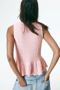 Haut péplum en tricot pointelle