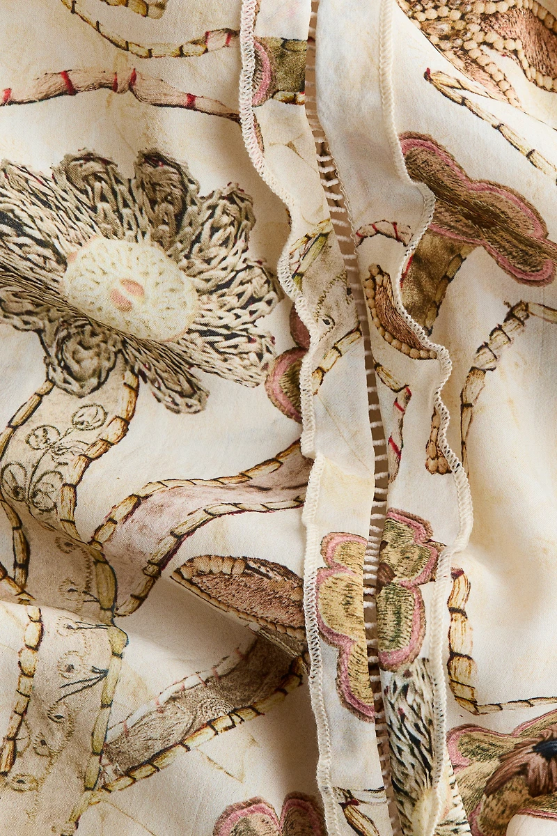 Robe plissée à imprimé fleuri et dos ouvert