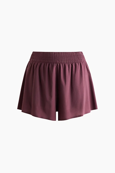 Short de sport superposé avec poche