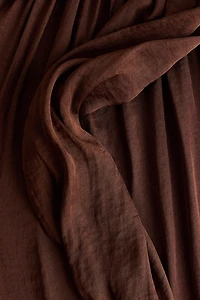 Pantalon à jambes ballon avec panneau drapé