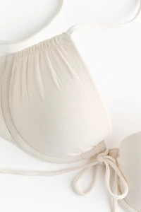 Haut de maillot pigeonnant