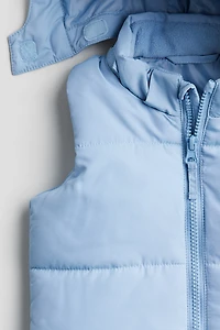Gilet matelassé sans manches avec capuche