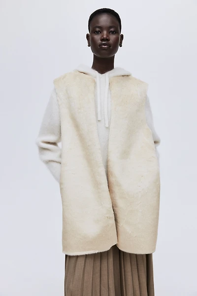 Longue veste sans manches