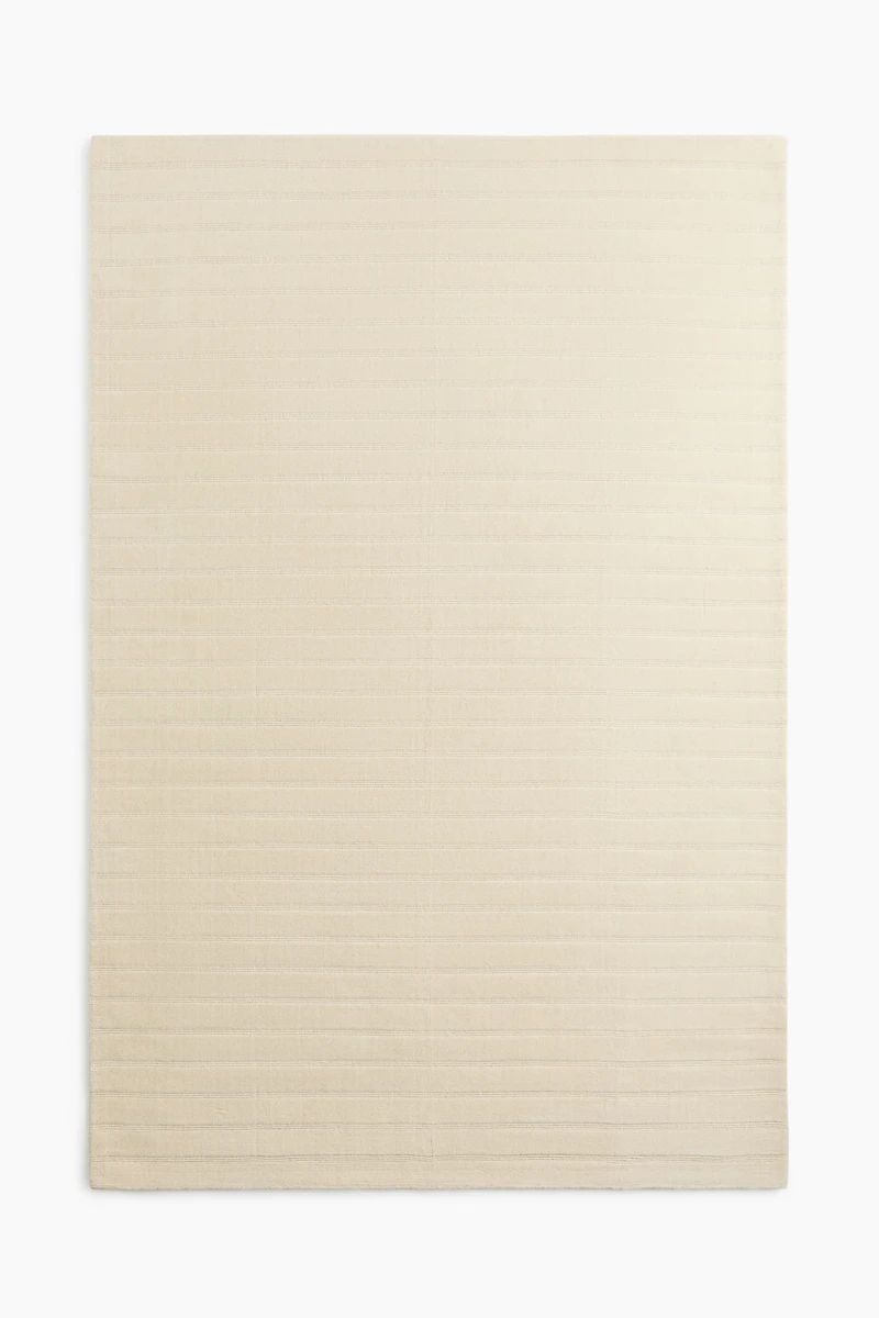 Grand tapis tissé à la main en laine mélangée