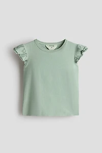 Haut à manches volants