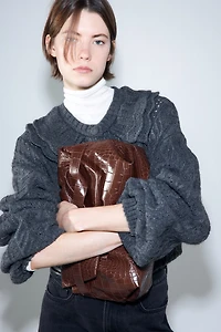 Gilet en maille torsadée avec col