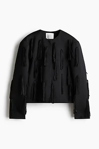 Veste frangée