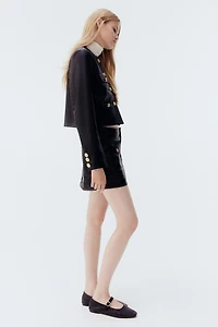 Veste en tissu enduit