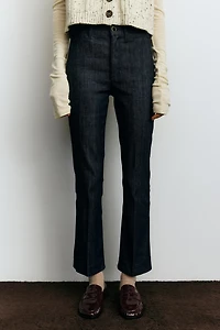 Jean aux chevilles évasé taille haute