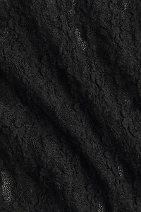 Pantalon évasé façon dentelle