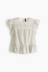 Blouse péplum avec dentelle