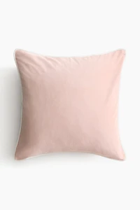 Housse de coussin en velours avec passepoil