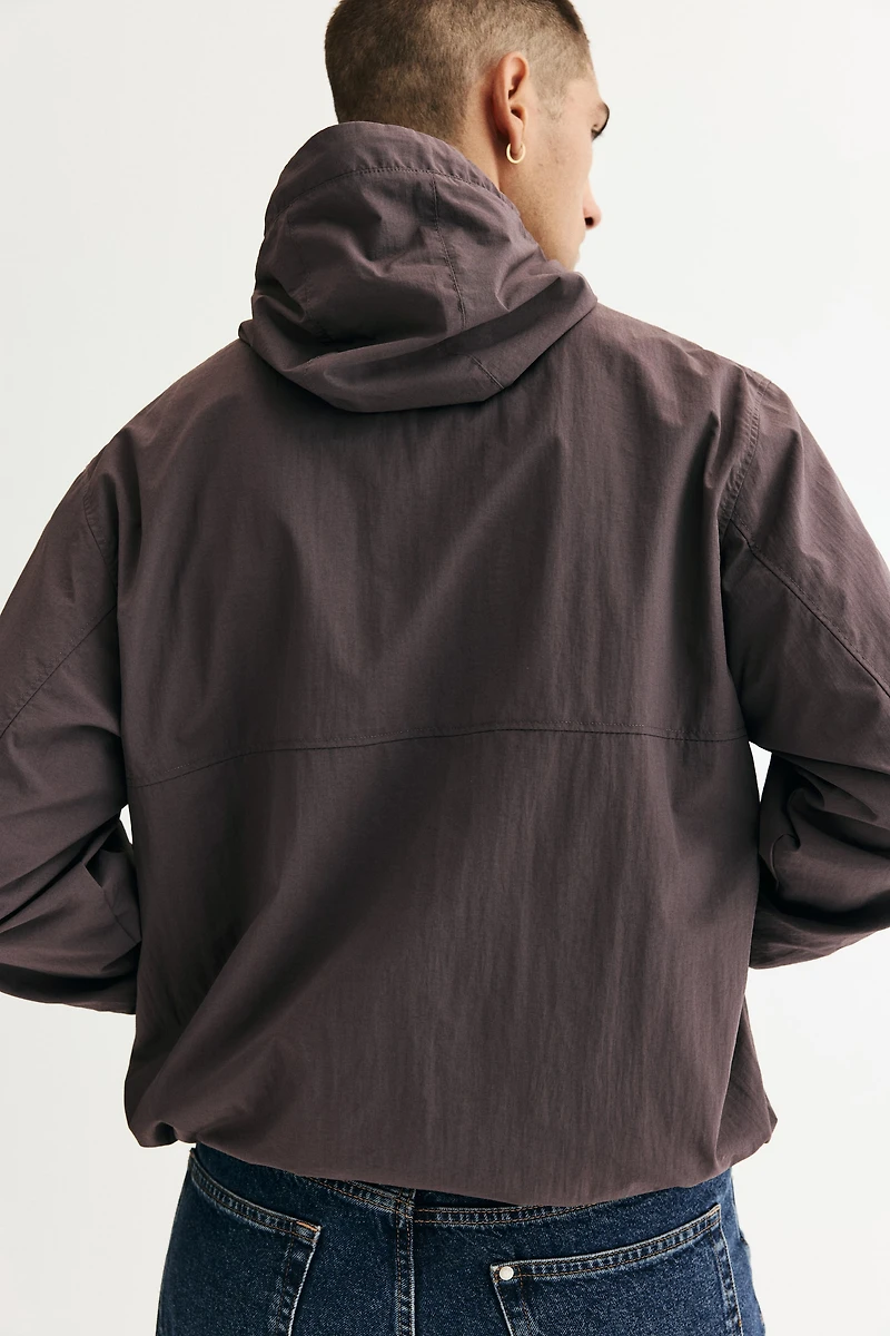 Veste coupe-vent à capuche