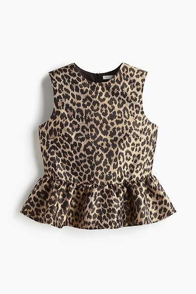 Haut péplum en tissu jacquard