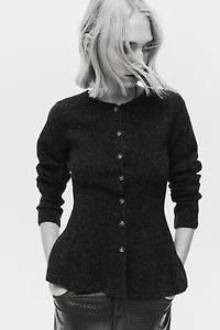 Gilet péplum en tricot côtelé