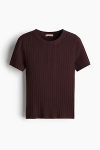 Haut en tricot torsadé