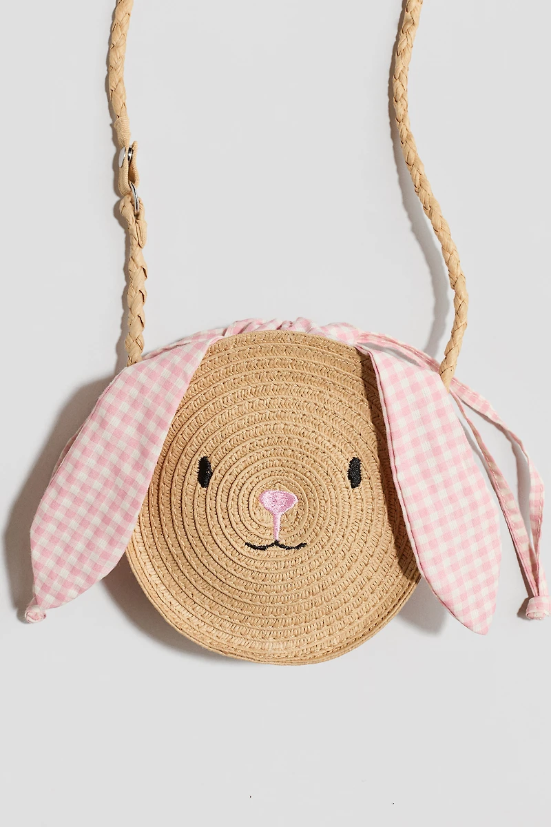 Sac à bandoulière en paille avec appliqués