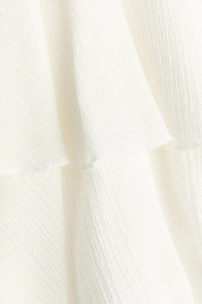 Robe asymétrique à volant