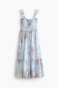 Robe volantée à corsage nid d'abeille