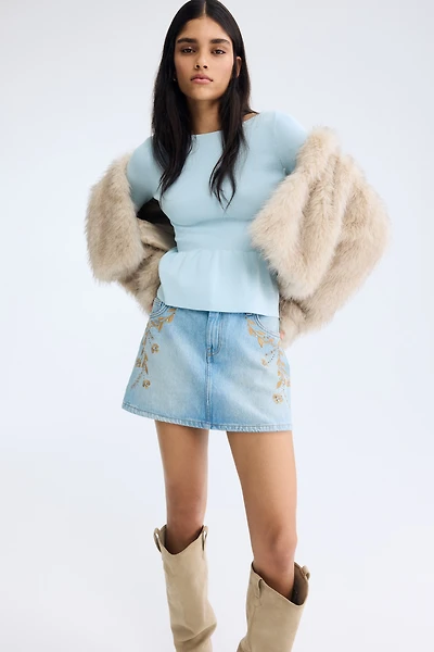 Haut péplum en tricot