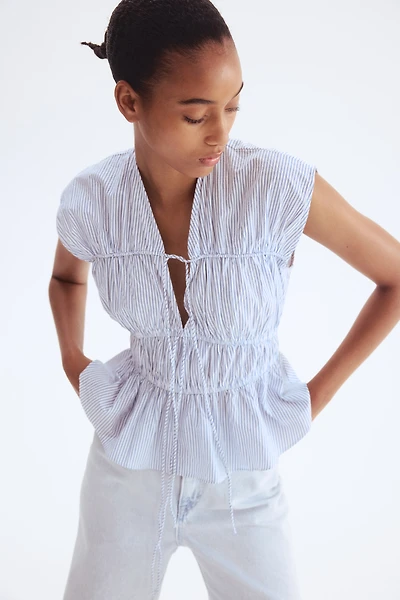 Blouse en popeline avec cordons de serrage