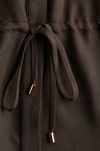 Haut en sergé avec cordon de serrage