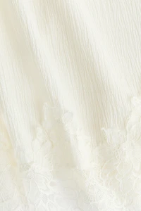 Haut froissé avec dentelle