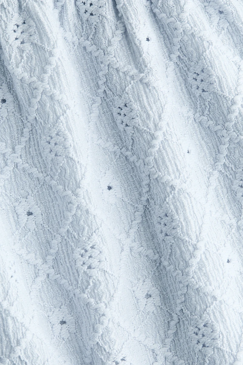 Blouse en jersey pointelle