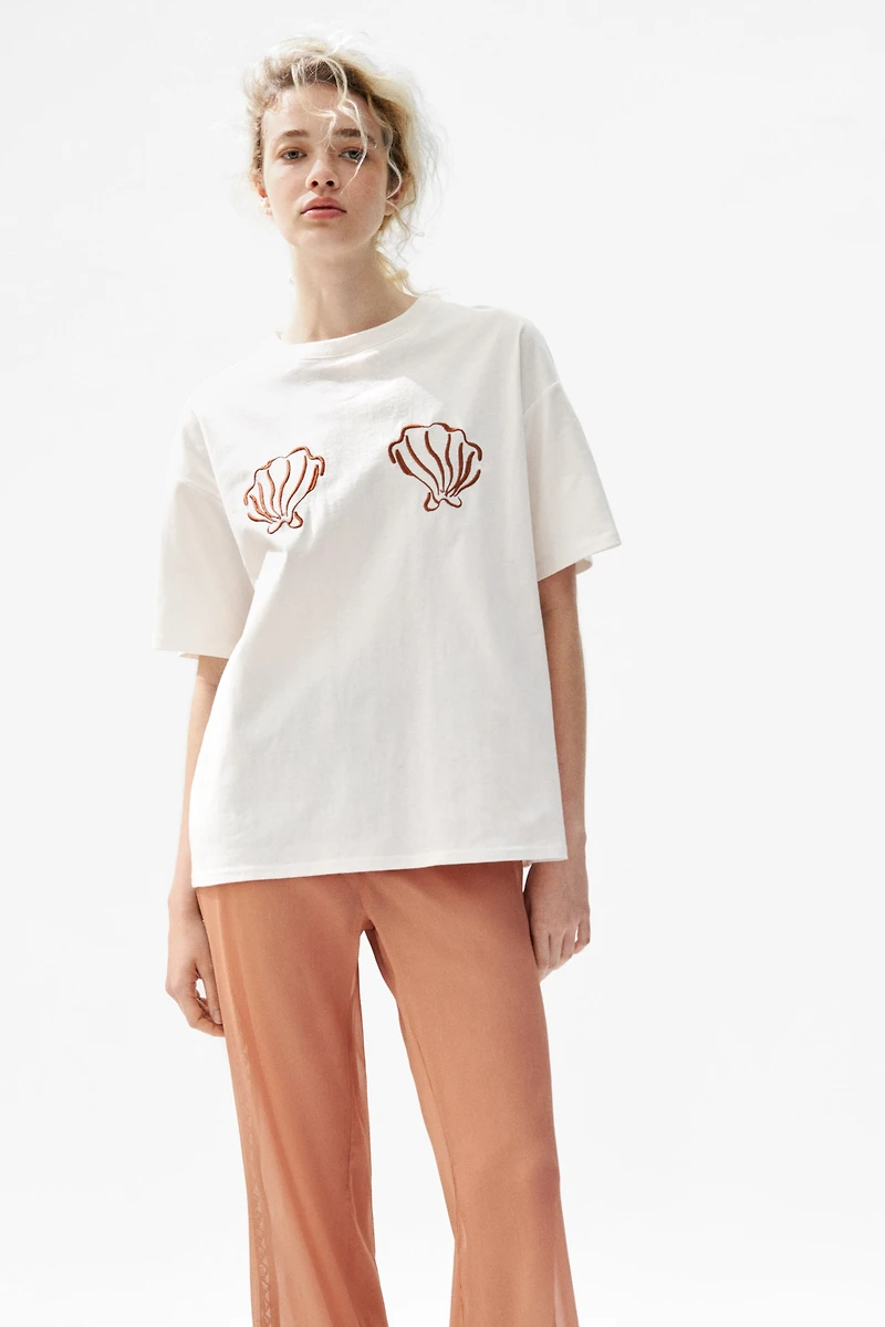 Pantalon à taille élastique avec perles fantaisie