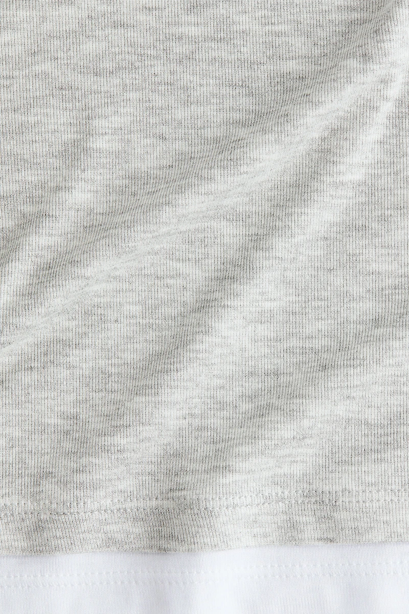 Haut à effet superposé