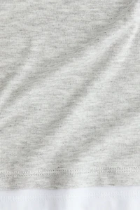 Haut à effet superposé