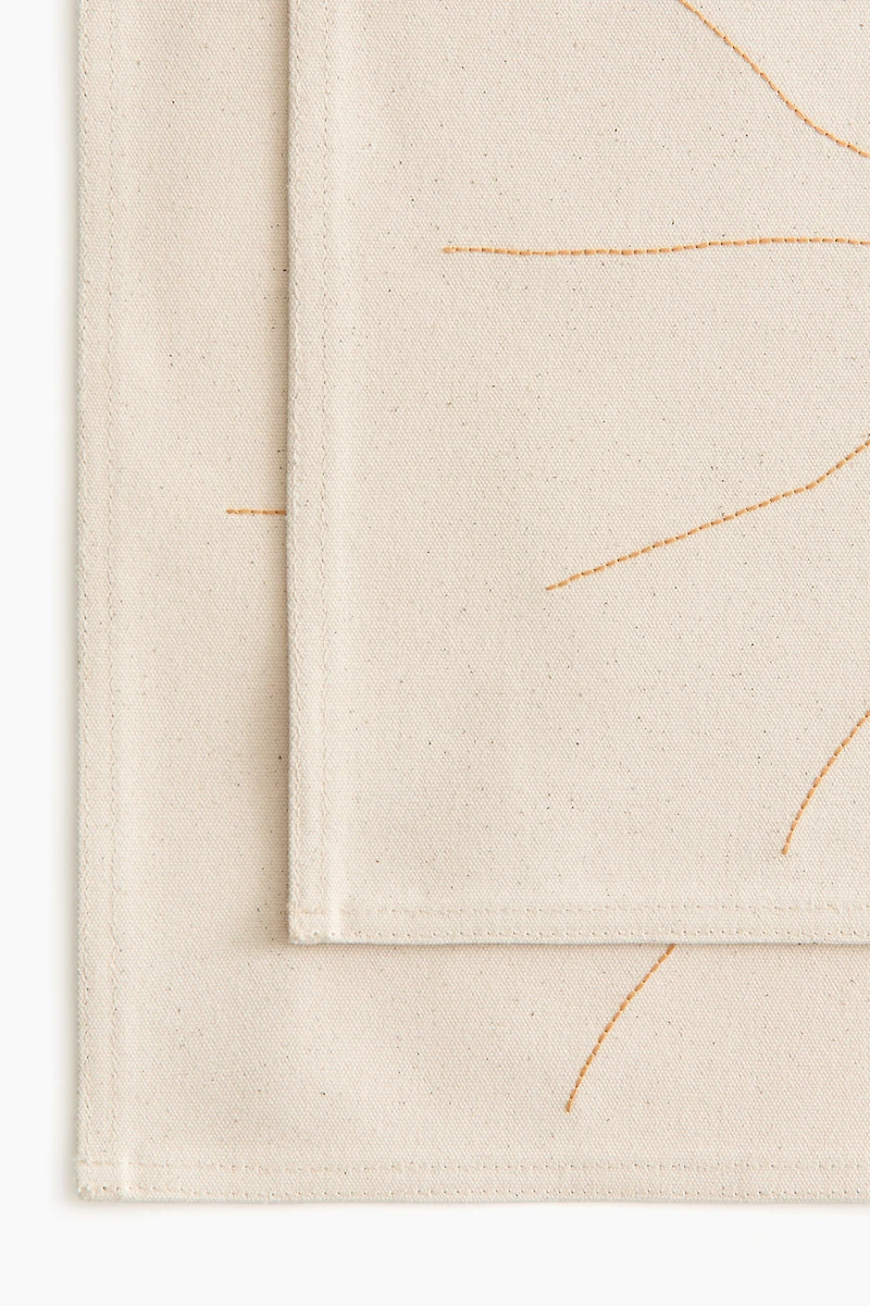 2-pack embroidery-detail place mats
