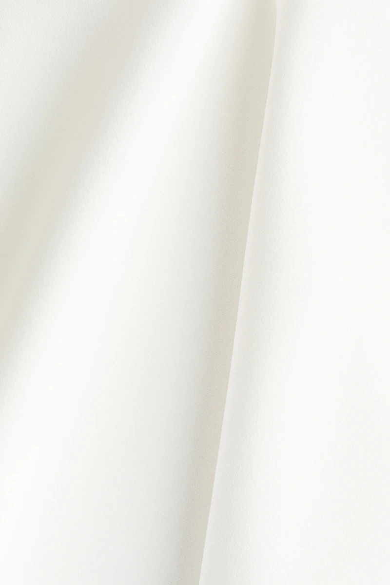 Haut péplum en jersey point de Rome