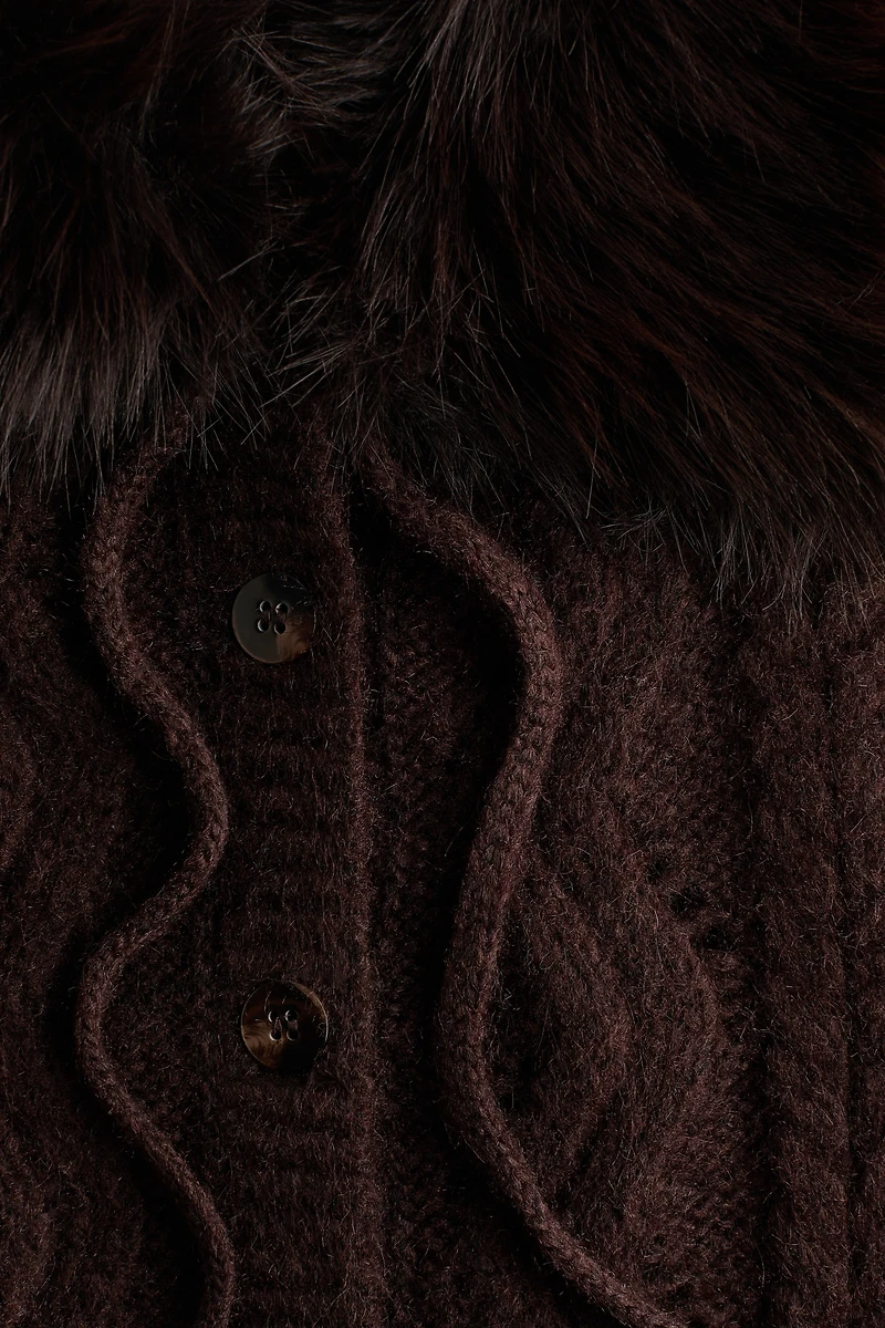 Gilet sans manches en tricot torsadé à col