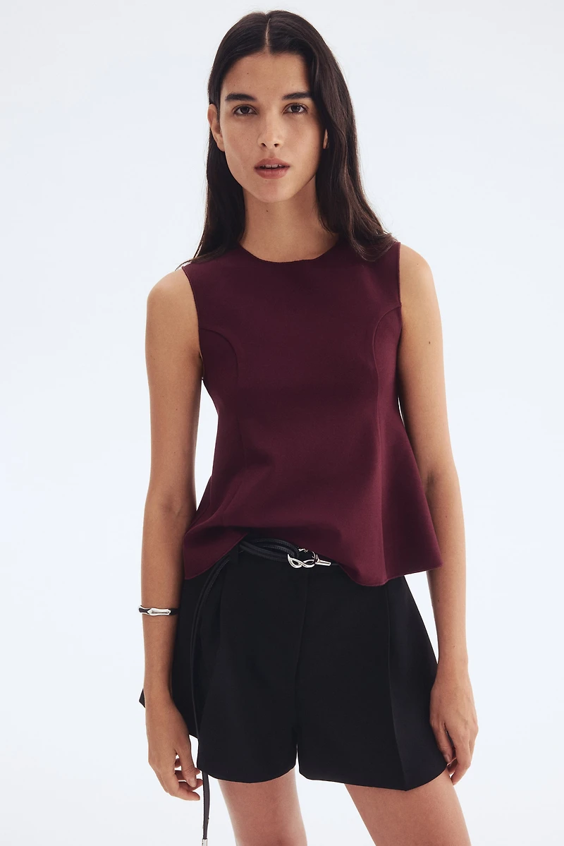 Interlock Sleeveless Peplum Top