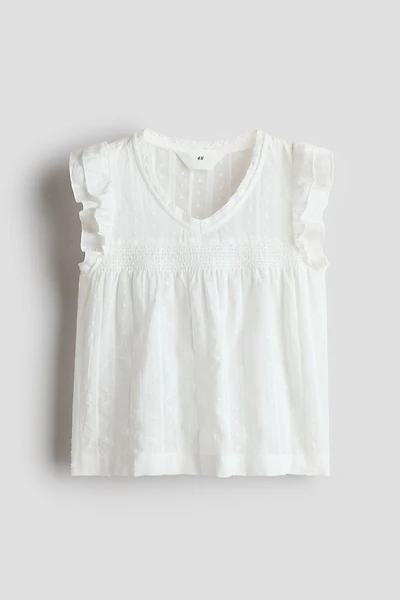 Blouse à manches volantées