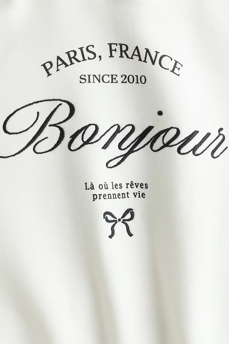 Chandail à capuche avec un motif