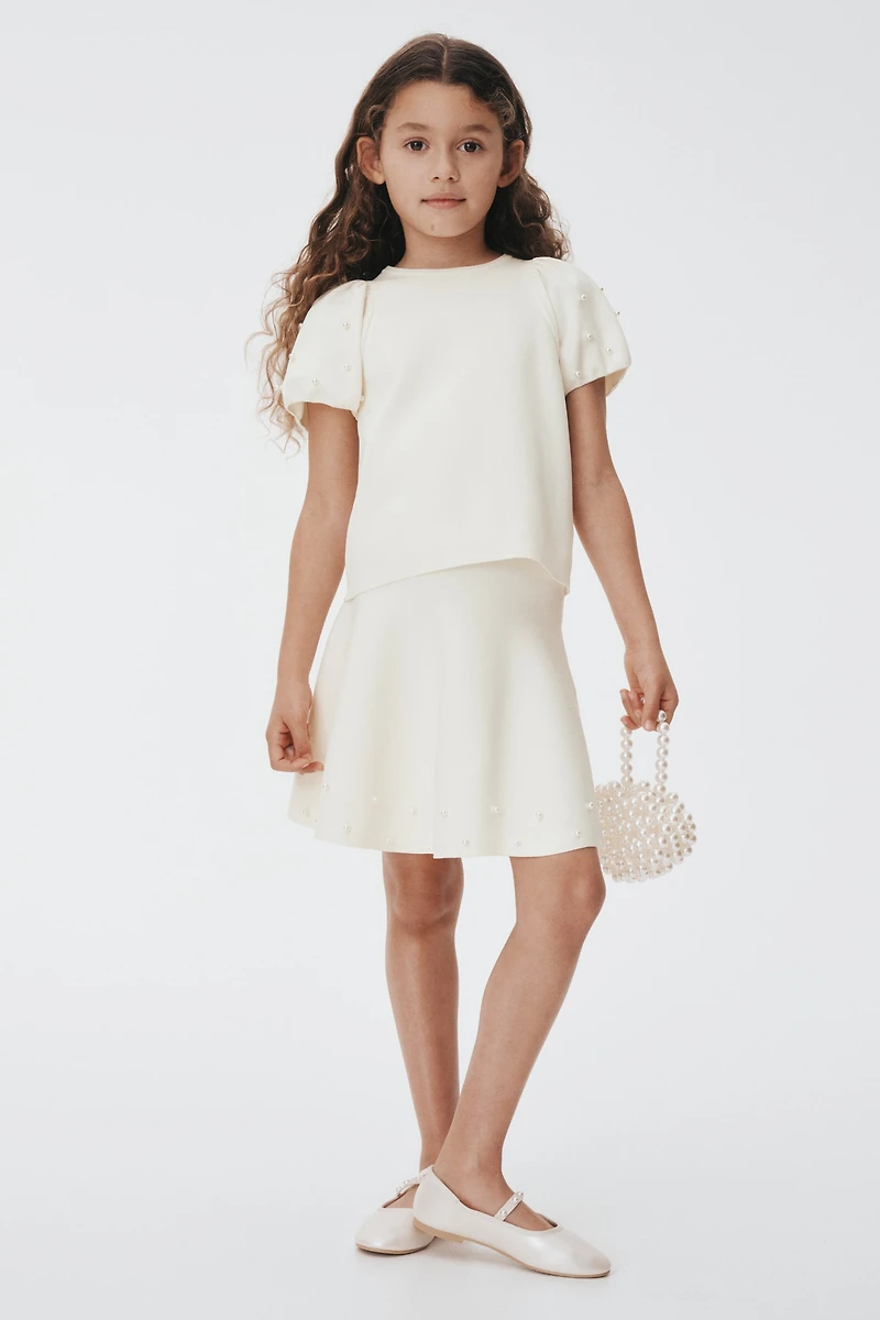 Jupe en tricot fin avec perles fantaisie