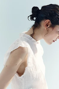 Haut péplum smocké