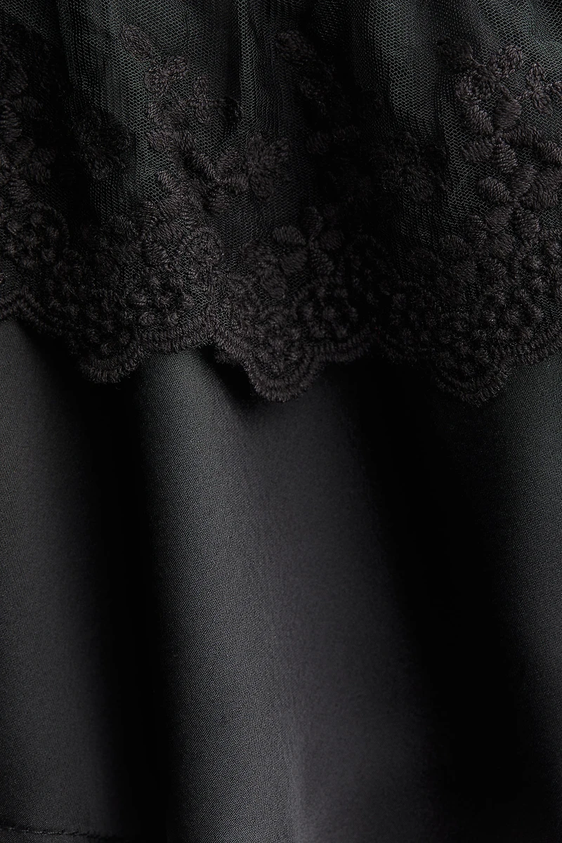 Blouse volantée en satin