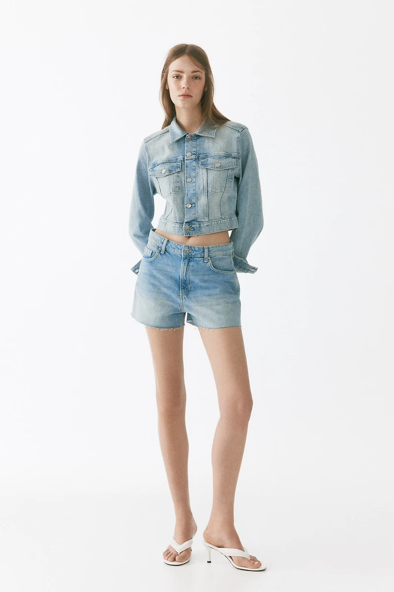 Raw-edge denim shorts